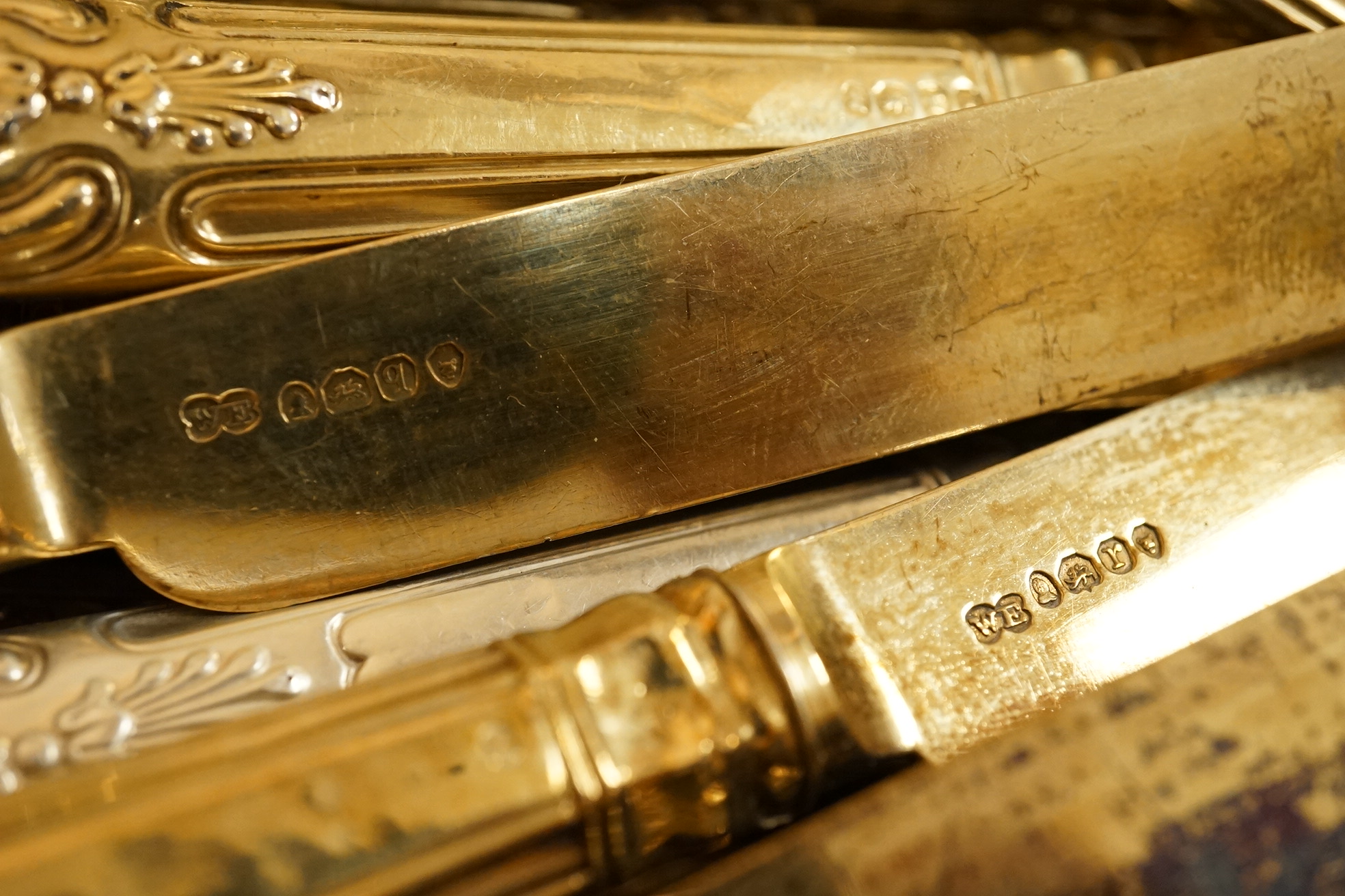 A set of eighteen William IV silver gilt King's pattern dessert knives, William Eaton, London, 1831/2, loaded handles, together with a set of twelve silver handled Kings pattern table knives and twelve matching dessert k
